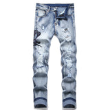 Snake Embroidered Ripped Denim Jeans